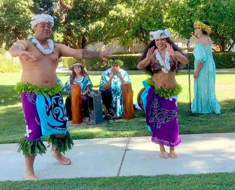 Photo - A couple dances together as they entertain the people of Cedar Creek.