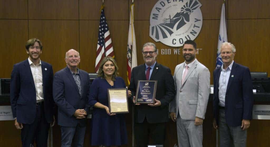 Photo - Madera County Chief Probation Officer Chris Childers receives a plaque and proclamation from the County Board of Supervisors. Childers retired from a 37-year career in law enforcement.