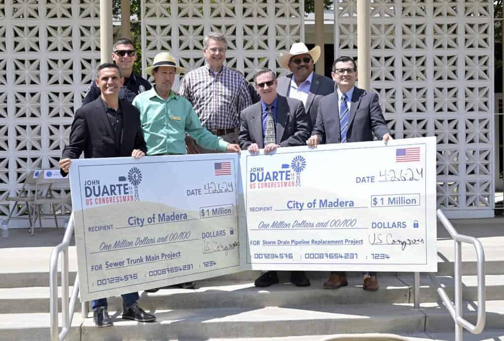 Photo - City of Madera dignitaries happily accept two checks for $1 million each from U.S. Congressman John Duarte during a check presentation Friday.