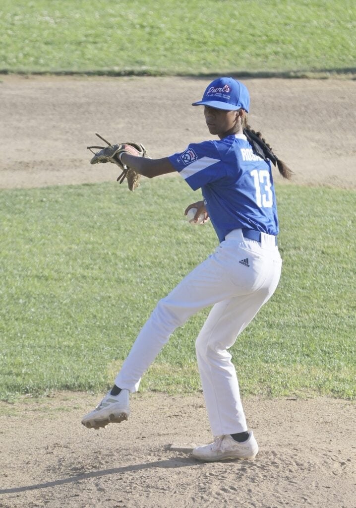 Photo - Purl’s Sheet Metal’s Anna Rosales throws a pitch during Wednesday’s District 10 Tournament of Champions game. Although she suffered the loss, she only allowed one earned run in a complete game. She struck out 10 and didn’t walk a batter. 