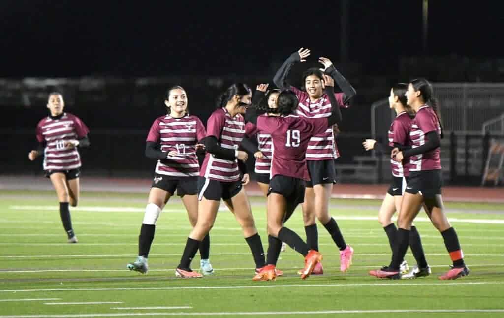 Photo - Matilda Torres’ Emma Velasquez gets congratulations from Yamileth Hernandez Lopez after scoring one of her three goals in Thursday’s 5-0 quarterfinals victory over Taft. 