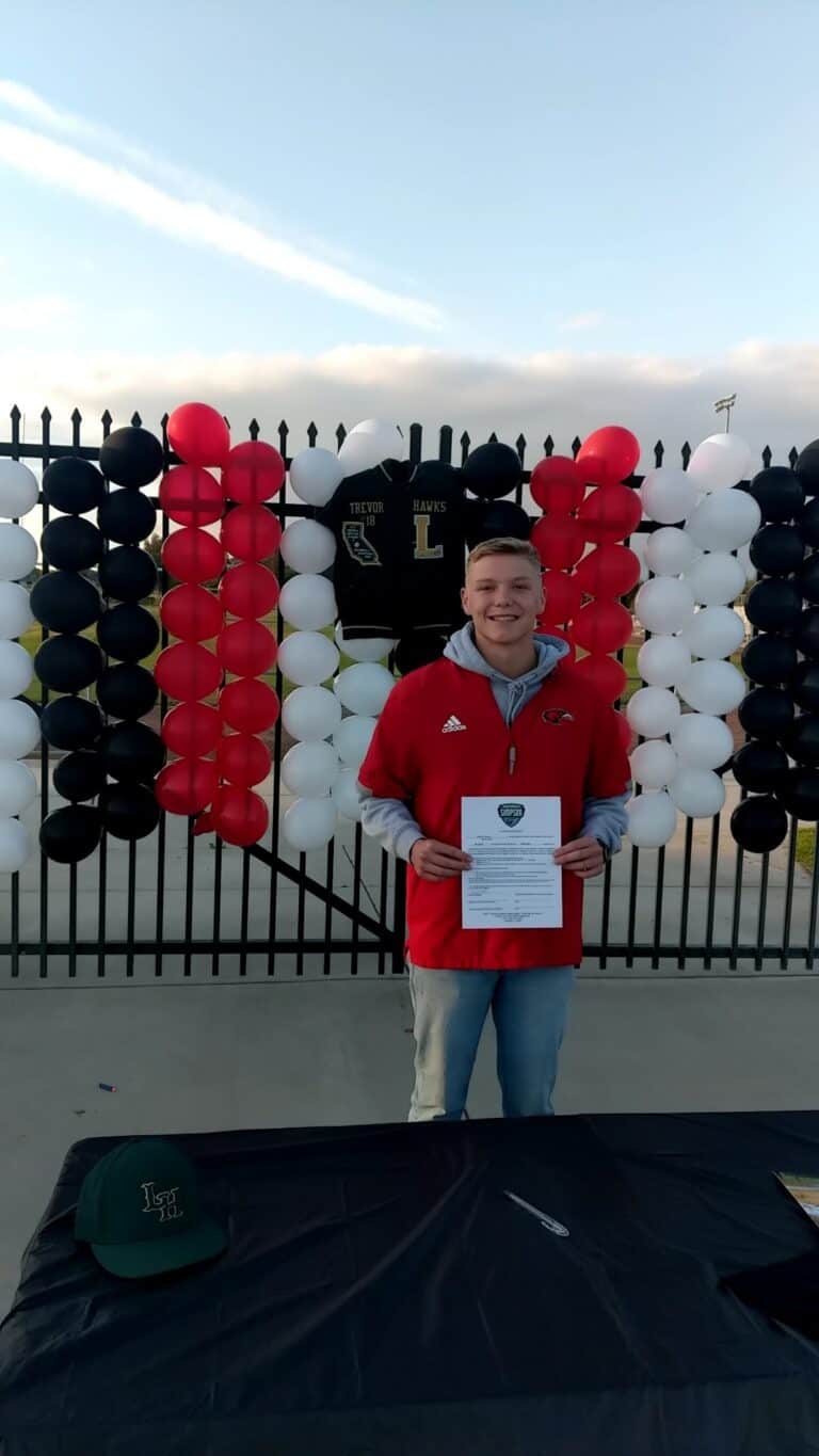 Amid distancing, Hawks baseball player signs