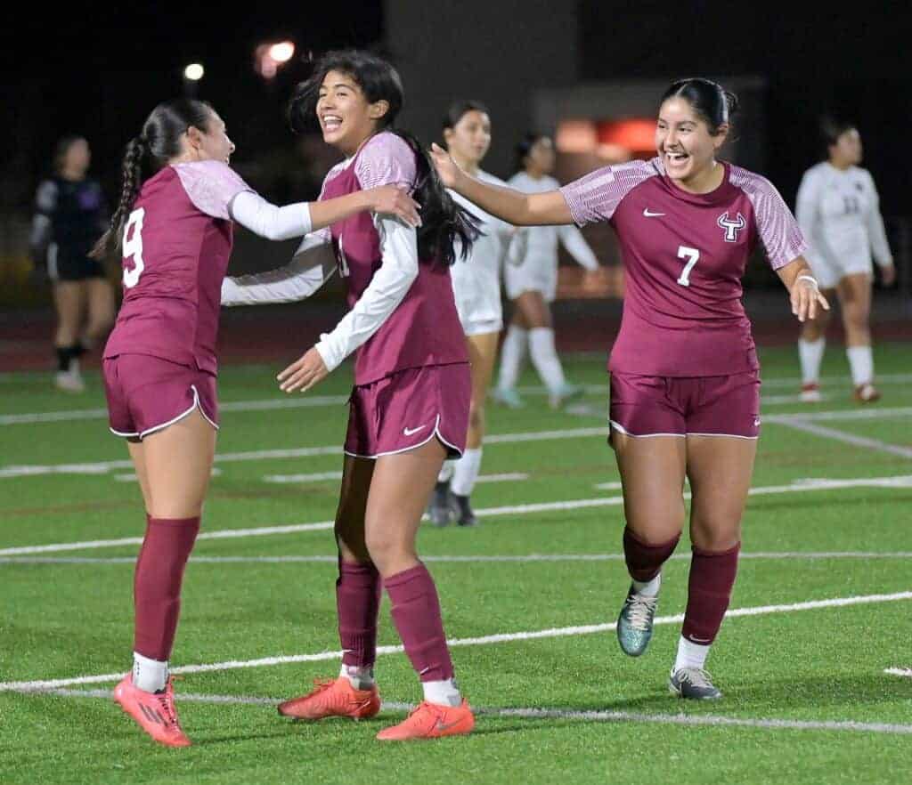 Photo - Torres’ Elihanna Gallegos (9) congratulates Emma Velasquez after Velasquez scored the first of her two goals in Wednesday’s 4-0 victory over Madera South.