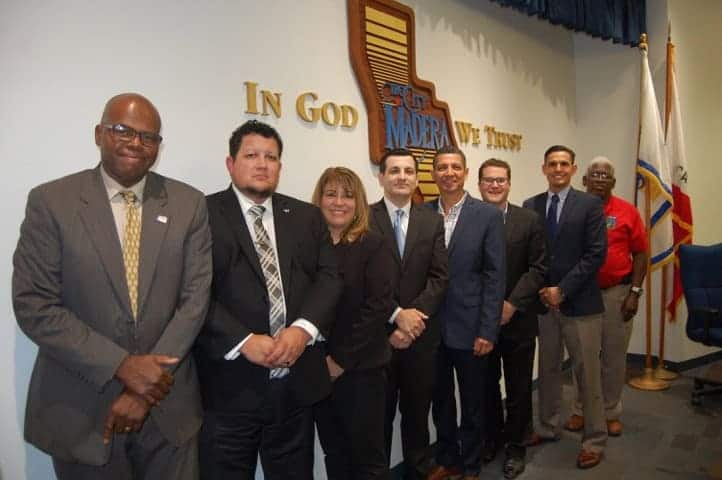 Photo - From left, on the city council stage Wednesday night: Council Members Derek Robinson, Charles Rigby and CeCe Gallegos, newly welcomed City Manager Arnoldo Rodriguez, mayor Andy Medellin, Council Member Will Oliver, Mayor Pro Tem Jose Rodriguez and Council Member Donald Holley.