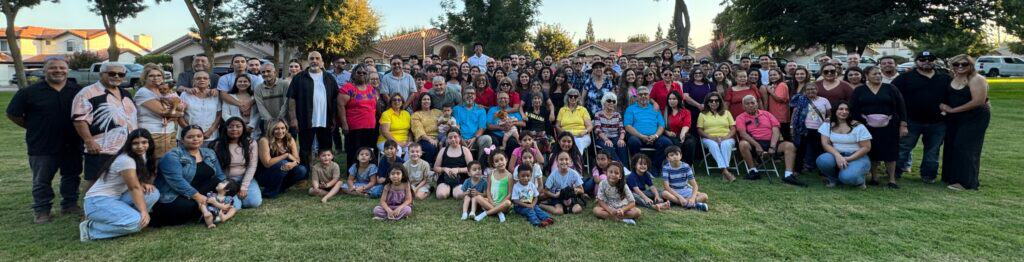 Photo - Emily Rey is surrounded by her entire family as she celebrates her 100th birthday on September 20. More than 150 family members converged to Madera to honor Rey.