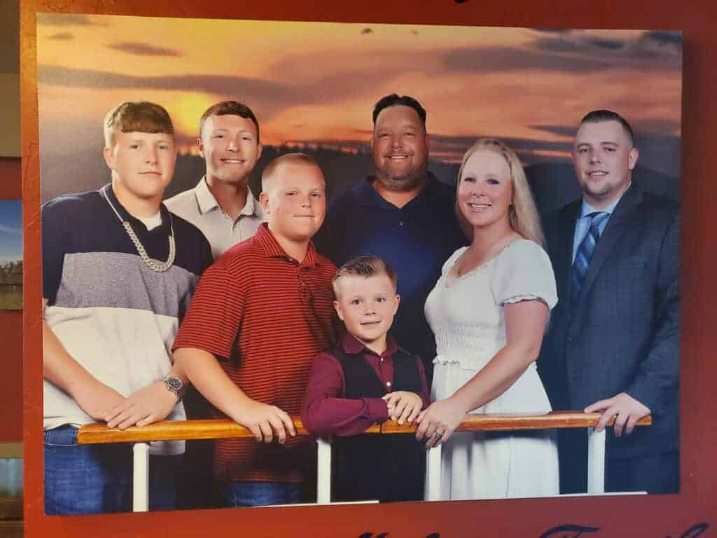 Photo - This portrait, taken in 2019, hangs on the wall at Perko’s Cafe in which Mike and Kelly Molina owned for many years. Wednesday, Mike Molina passed away from complications of pneumonia. From left are Tommy, Chris, Benji, Sammy, Mike, Kelly and Anthony.