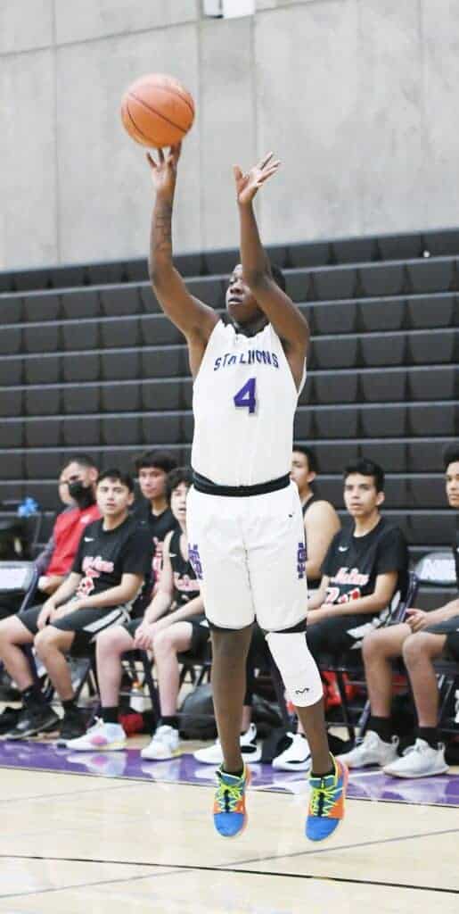 Photo - Madera South’s C.J. Robinson hits a 3-pointer during Wednesday’s loss to the McLane Highlanders.