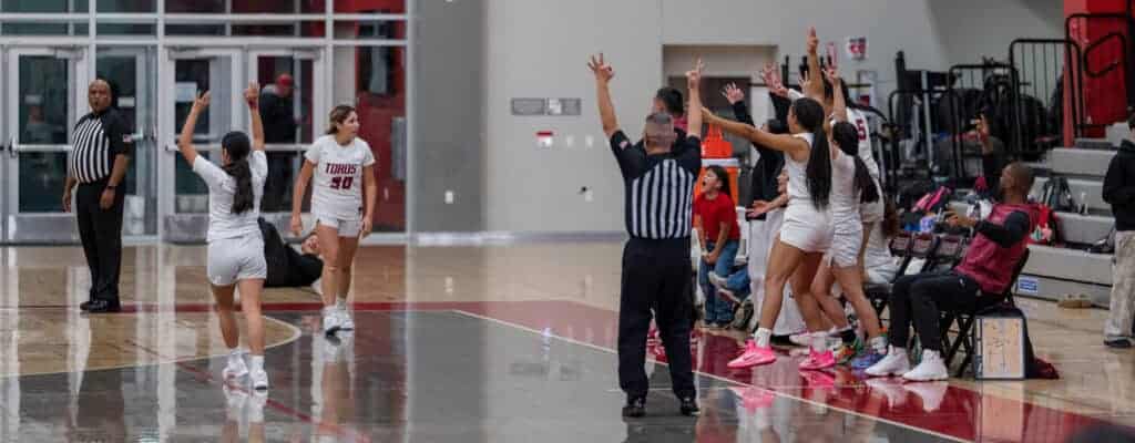 Photo of The Matilda Torres bench reacts to Aaliyah Marcello (30) hitting a 3-pointer at the end of Wednesday’s victory over the Dos Palos Broncos. Marcello also had a look of disbelief that she made the shot.
