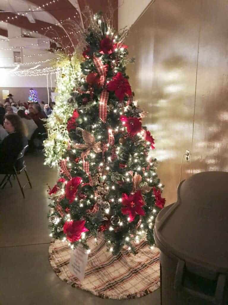 Photo - Holy Family Table’s tree for 2022 was beautifully decorated for Trees for Charity’s theme of Winter Wonderland.