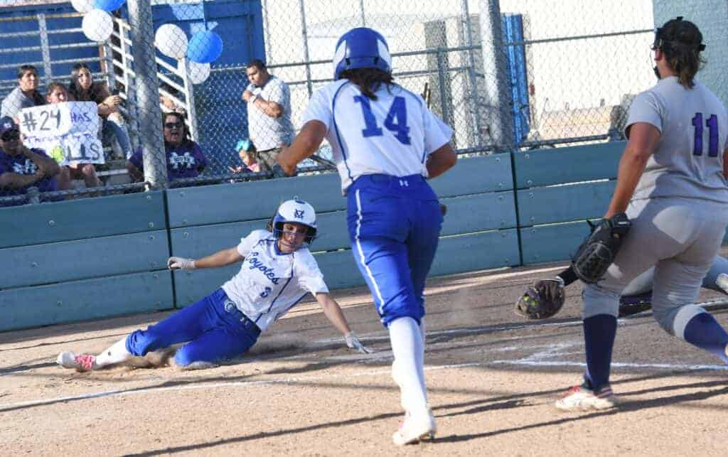 Photo - Madera’s Taylor Brooks appears to drag her hand across home plate during Madera’s win over Madera South. However, the umpire saw differently and called her out on the play.