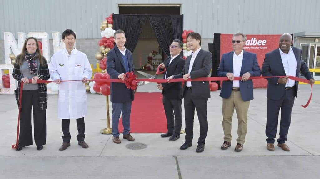 Photo - Calbee representatives gather for a ribbon cutting ceremony at their Madera location on Friday morning. Calbee produces a variety of snack products.