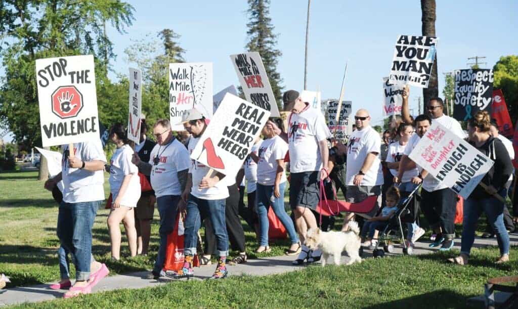 Photo - More than 100 participate in the 2019 Walk A Mile in Her Shoes march against sexual assault event hosted by Community Action Partnership Madera County Victim Services at Courthouse Park.