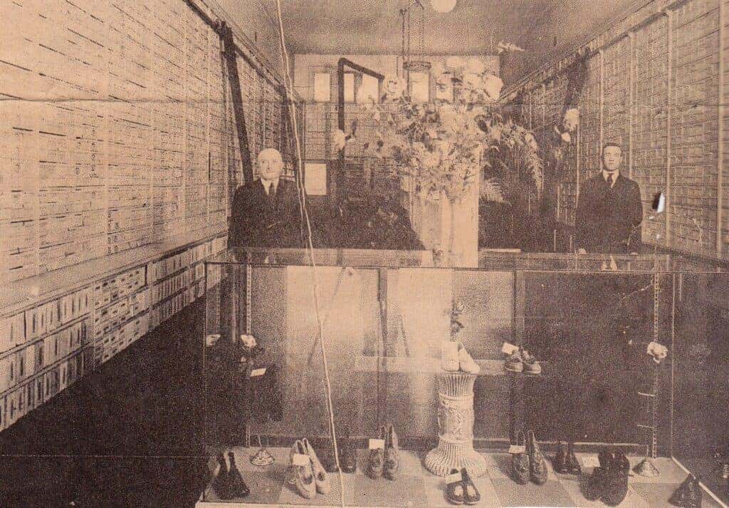 Photo - Herman Brammer and son William pose in their shoe store 100 years ago — one year before it was transformed into a three-story building that is still standing today on the north side of Yosemite Avenue.