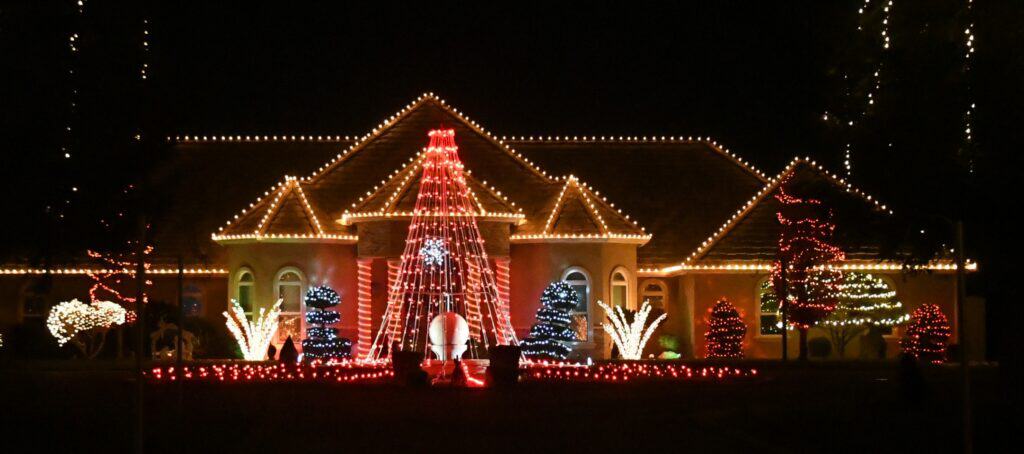 Photo - Robert Bishop’s house on Avenue 20 1/2 is a holiday favorite display that visitors tune in to radio as lights flash in sync with Christmas music playing on FM 100.9.