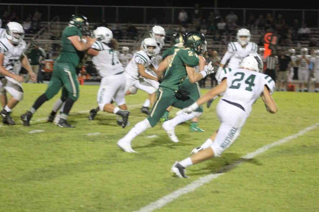 Photo - Liberty’s Tyler Miller sprints past Templeton defenders to score a game-tying 41-yard touchdown run that set the stage for Aramel Villa’s game-winning 32-yard field goal in Friday’s victory over the Eagles.
