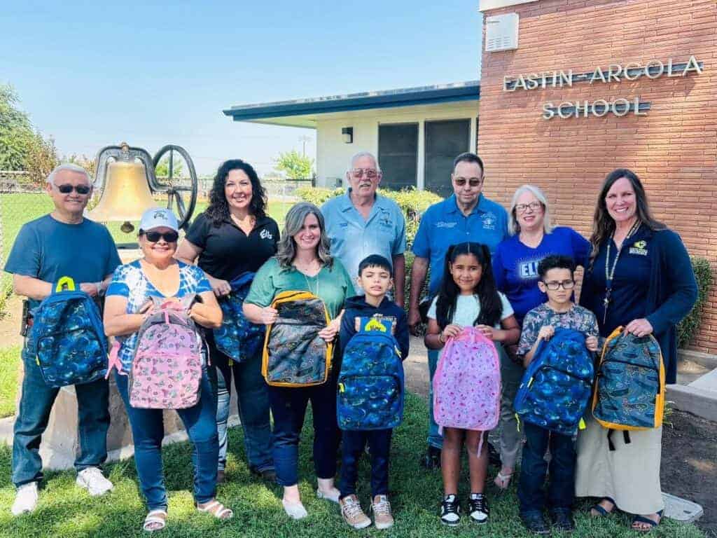 Photo - Members of the Madera Elks Lodge pose with students and staff from Eastin Arcola after providing backpacks and more, completing their Backpack Project through the Elks National Foundation Grant process.