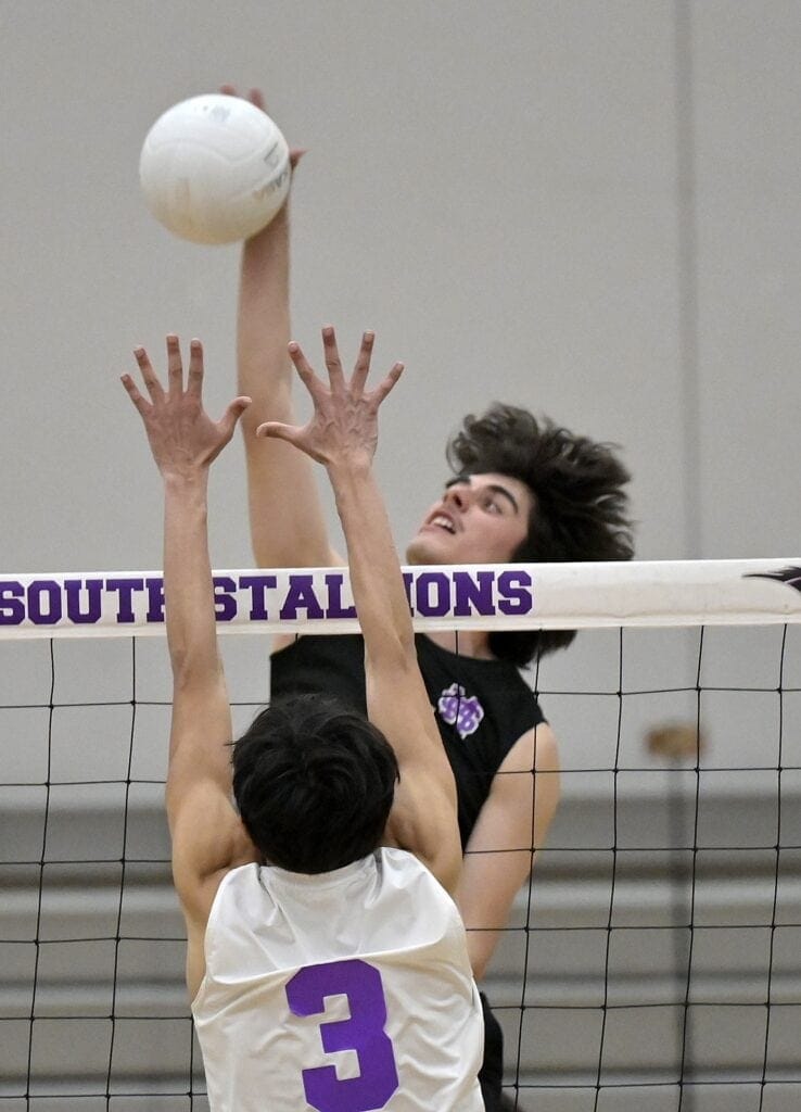 Photo - Madera South’s Doug Fuentes rises up for one of his team-leading 12 kills in Tuesday’s win over Fresno. 
