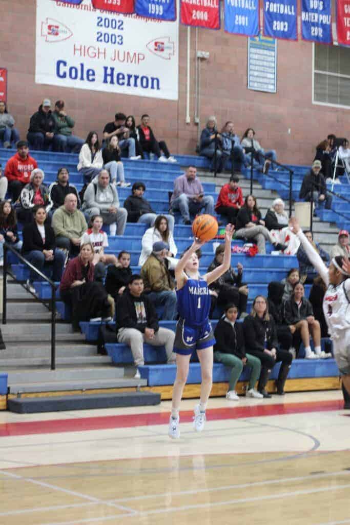 Photo - Madera’s Lilly Smith shots a 3-pointer during Tuesday’s loss to Sanger. She led the Coyotes with 14 points and hit a pair of 3-pointers.