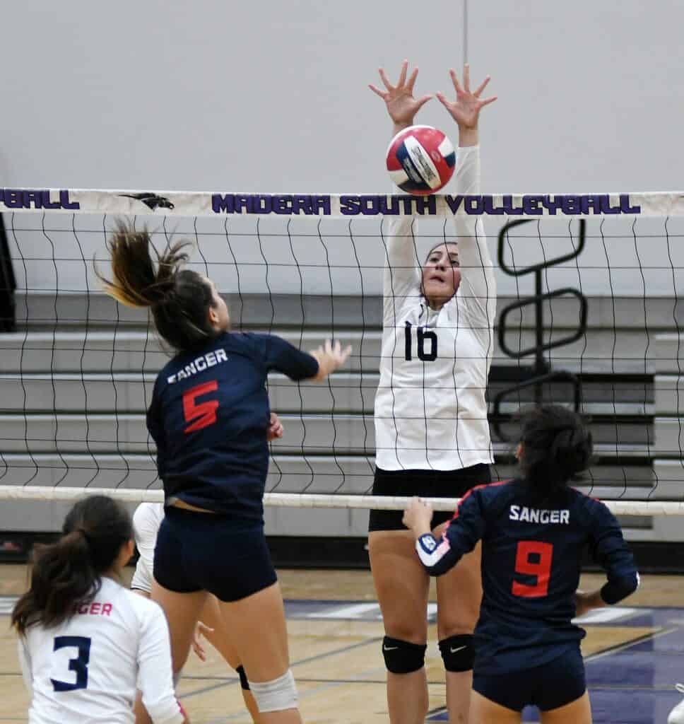 Photo - Madera South’s Bianca Guevara reaches up for a block during Thursday’s win over the Sanger Apaches.