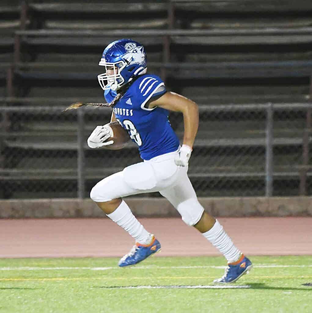 Photo - Madera’s Izaak Lopez sprints down the sideline into the end zone to score Madera’s lone touchdown in Friday’s loss.