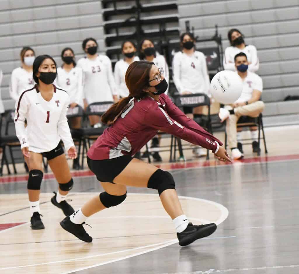 Photo - Matilda Torres libero Sol Barrera gets a dig to start the offense during Monday’s three-set loss to Golden Valley.