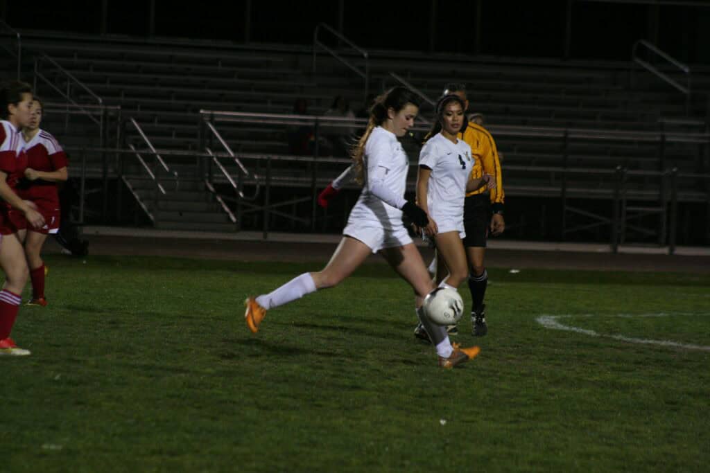 Photo - Former Liberty standout Juliet Olsen takes a shot during a 2014 match. the former LHS Senior Athlete of the Year graduated from Chapman University in 2018 and is also working for the school.
