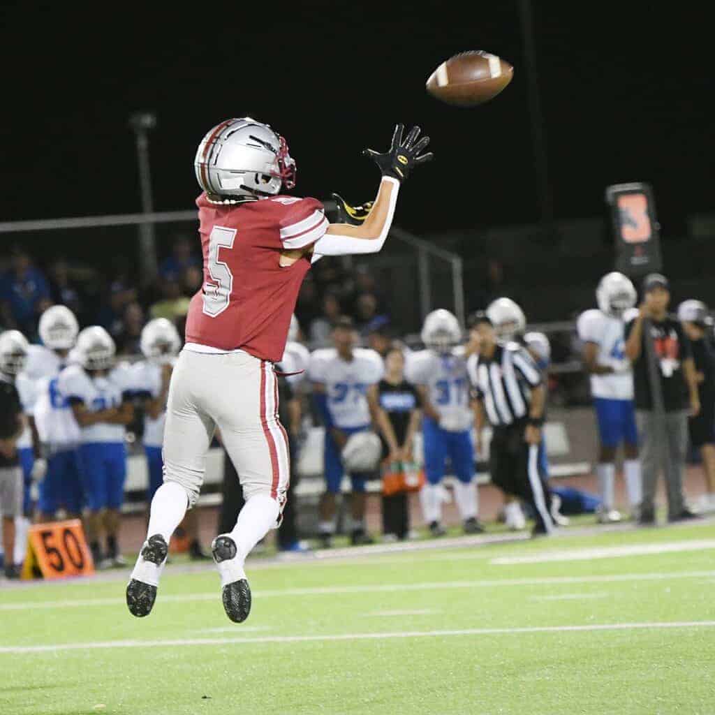 Photo - Matilda Torres’ Ian Cortez-Lopez goes in the air for an interception near the Sanger West goal line in Friday’s win.