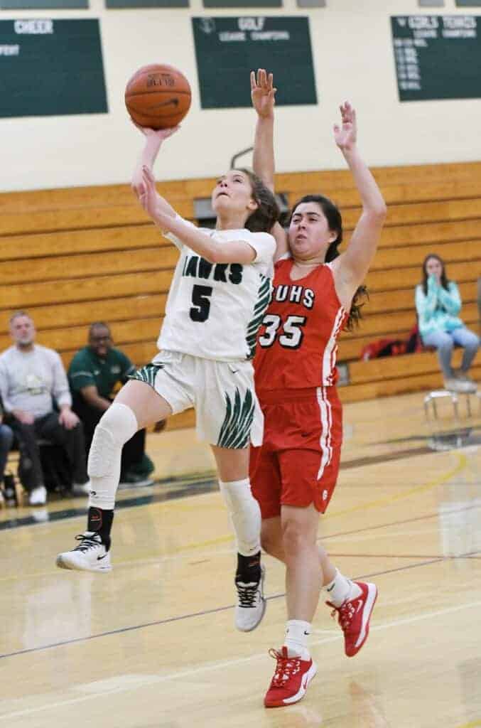 Photo - Liberty’s Lizzie Stinson goes up for a layup in front of Chowchilla’s Sydni Ringersen during Tuesday’s game. Stinson scored a team-high 15 points in the loss.