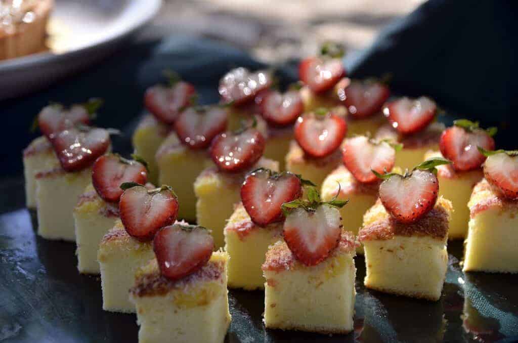 Photo - Cubes of vanilla cake with some fresh fruit on top are great for an easy and delicious dessert or snack.