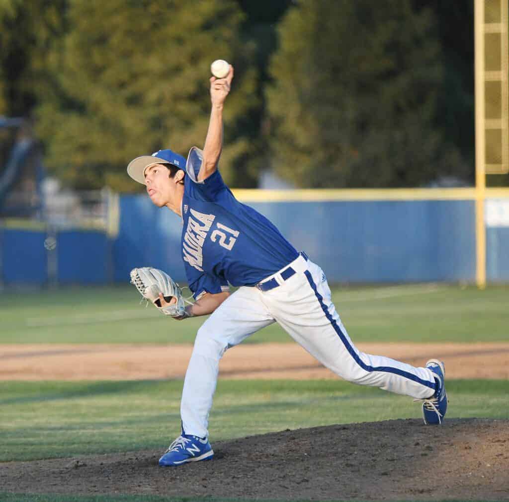 Photo - Madera’s Frankie Espejo throws a pitch during a complete game victory over Sanger on Tuesday. He struck out 12 and allowed just two hits in the win.