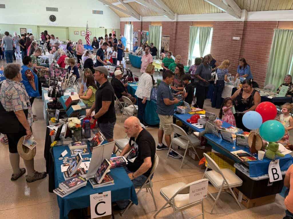 Photo - More than 40 authors set up tables to display and sell their books during the Heart of California Book Faire on Saturday.