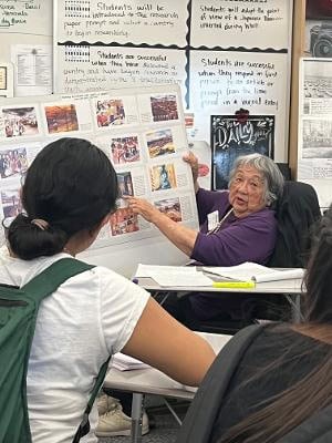 Photo - Marion Masada talks with students in Valerie Shelton’s Historical Literacy class at MSHS.