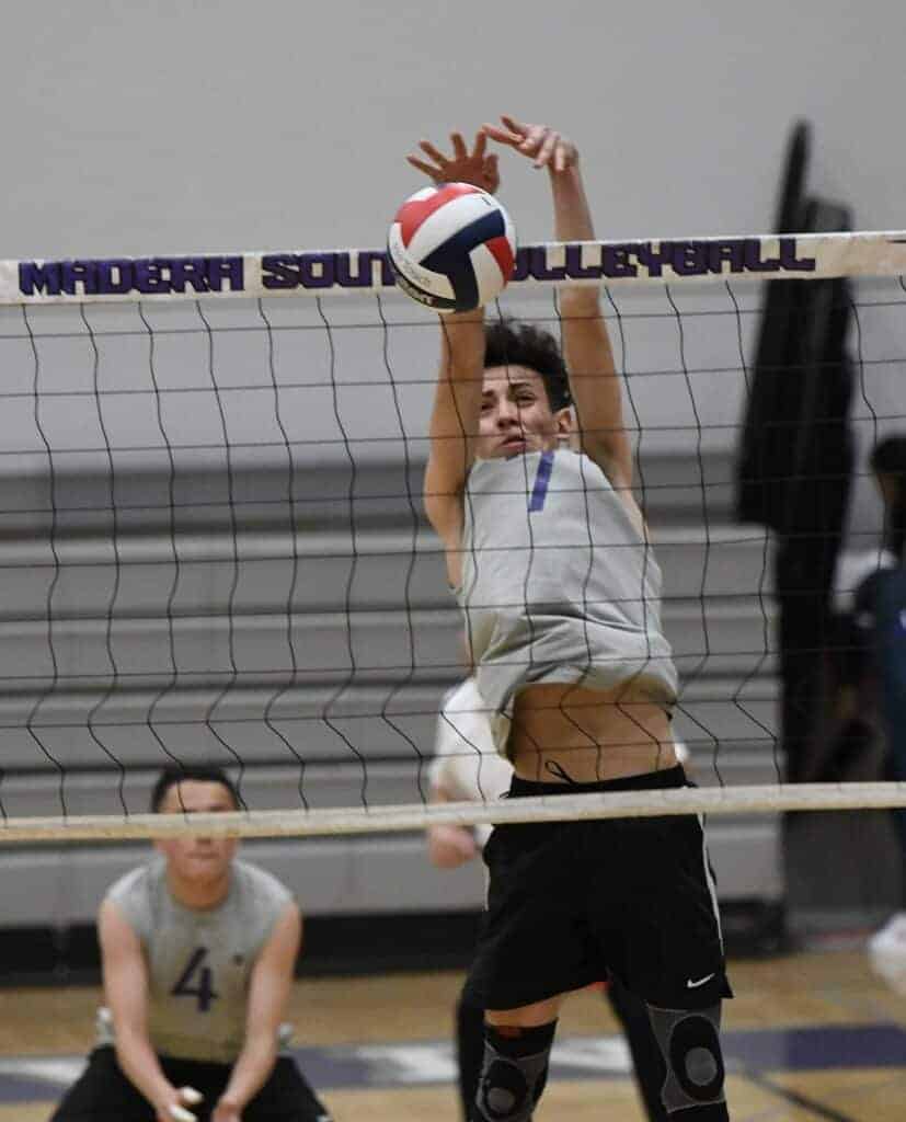 Photo - Madera South’s Ruben Jaimez goes up for a block during Wednesday’s loss to the Clovis North Broncos. He was one of two Stallions with double-digit kills with 10.