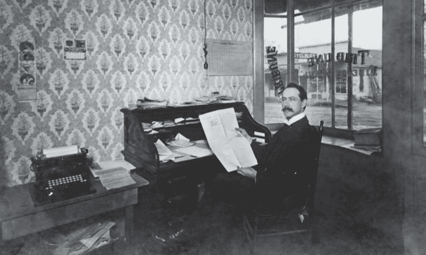 Photo of Howard Clark, shown here at his desk at the Madera Tribune, vigorously opposed the integration of Madera’s city owned swimming pool.