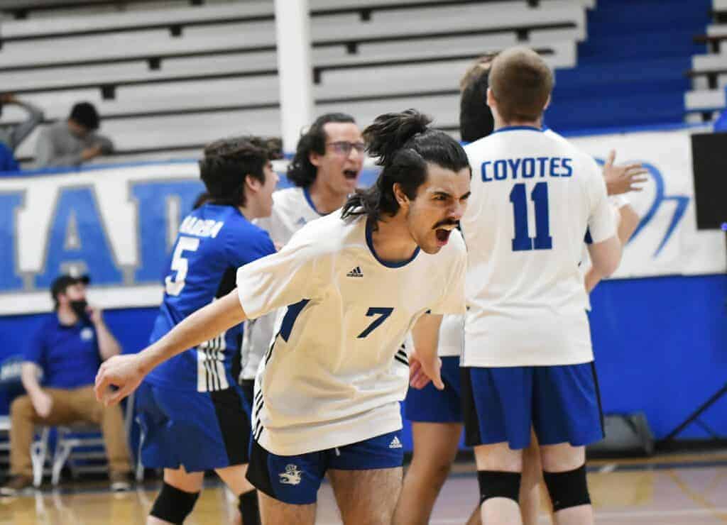 Photo - Madera’s Joshua Landeros celebrates a point during Thursday’s match with Hoover. The Coyotes lost in five in a non-conference match in Joe Flores Gym.