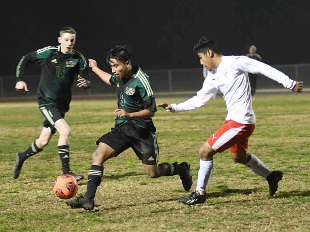Photo - Liberty’s Jesus Ponce controls the ball in Thursday’s match against Chowchilla while Clayton Cardoza comes in for support.