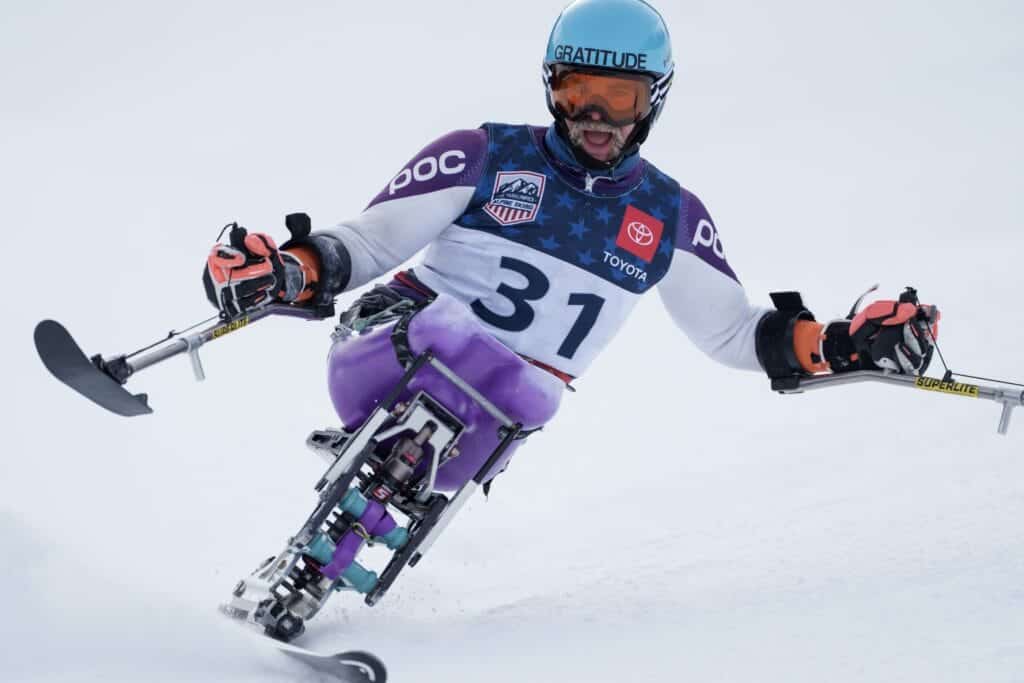 Photo - Zach Williams was born without his tibia bones and had his legs amputated when he was 18 months hold. Williams is now getting ready for the 2024 ski season as a member of the U.S. National Para-Alpine Ski team after taking up the sport only five years ago.