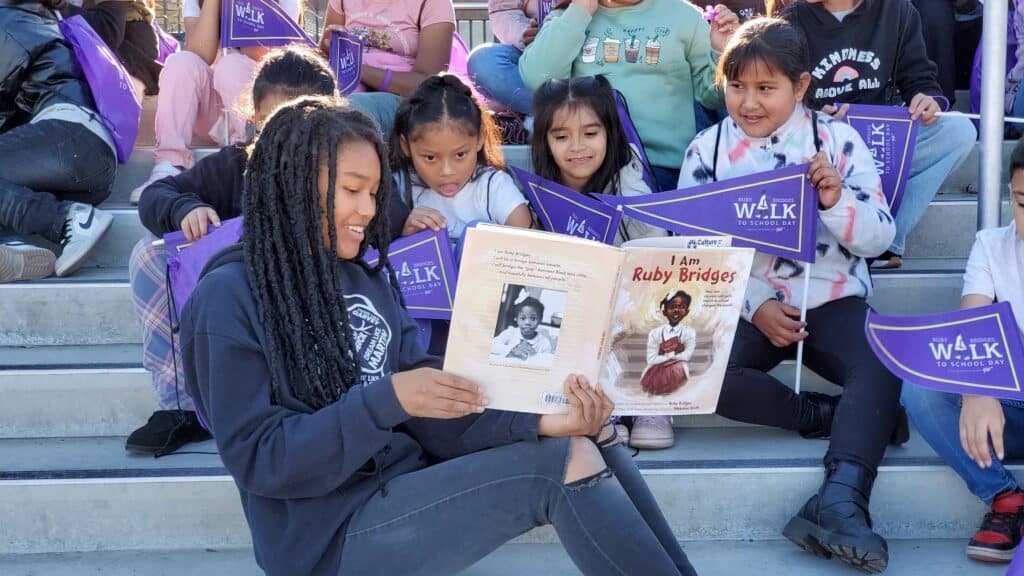 Photo - Madera South High School BSU Student Alayja Hall reads the book “I am Ruby Bridges” to Alpha Elementary Students.