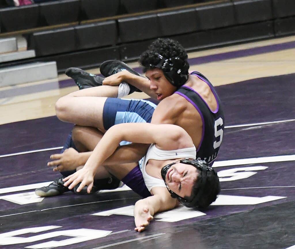 Photo - Madera South’s Diego Jaimes works his Bullard opponent into an eventual pin during Wednesday’s dual meet victory.