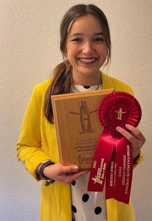 Photo - Madera’s Regan Fringer shows off the awards she received after competing in the Houston Livestock Show and Rodeo. She placed second in swine judging at the March event.