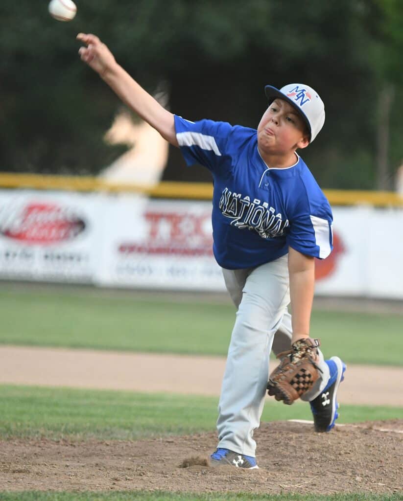 Photo - Madera National pitcher Theran van Loon throws a pitch during a no-hitter against Sierra Mountain. Madera National advanced to the next round with a 17-0 victory.