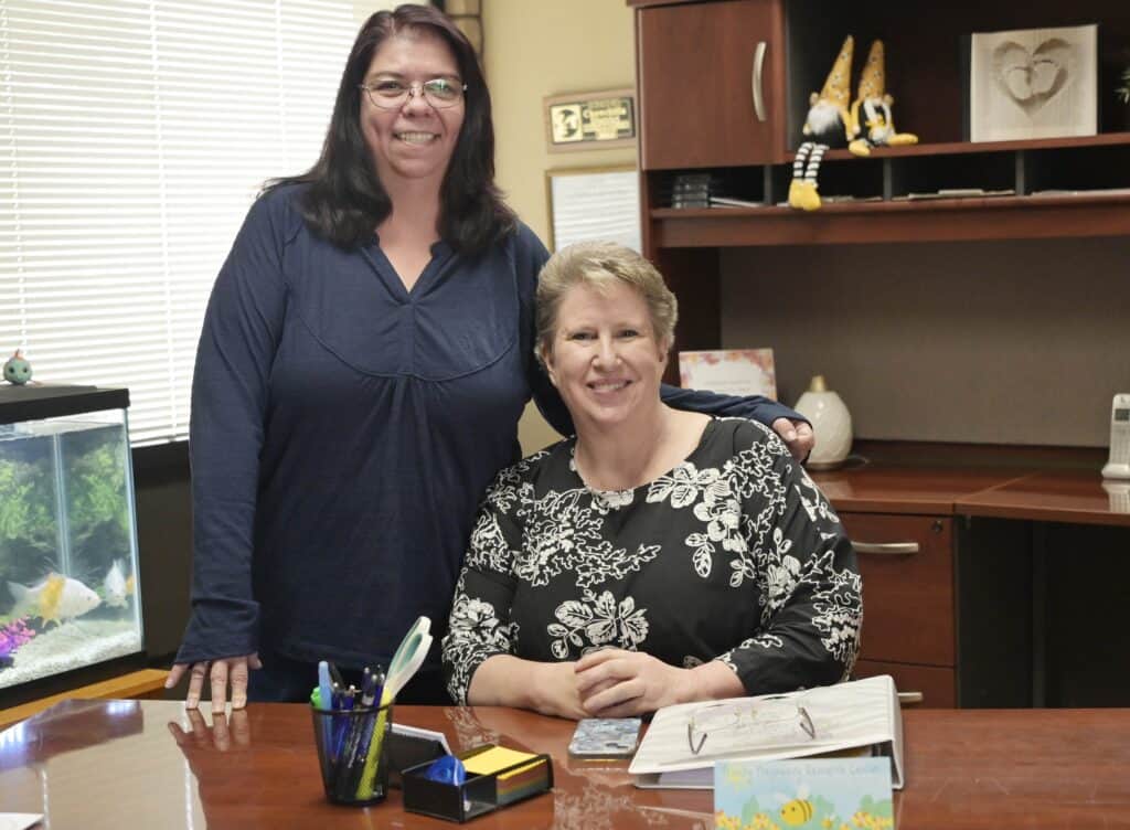 Photo - Advocate Trish Davis, left, and Director Bethany McLain of Trinity Pregnancy Resource Center, are preparing for the 17th annual banquet on Saturday.