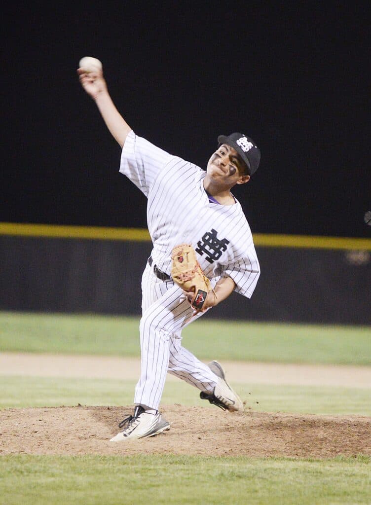 Photo - Madera South’s Bryan Malagon throws a pitch during a 7-0 loss to Edison, Malagon didn’t allow a hit in 2 1/3 innings pitched in relief. The Madera South Stallions baseball team knew it was in for a tough game against the Edison-Fresno Tigers, but knew it had a chance with its ace on the mound.