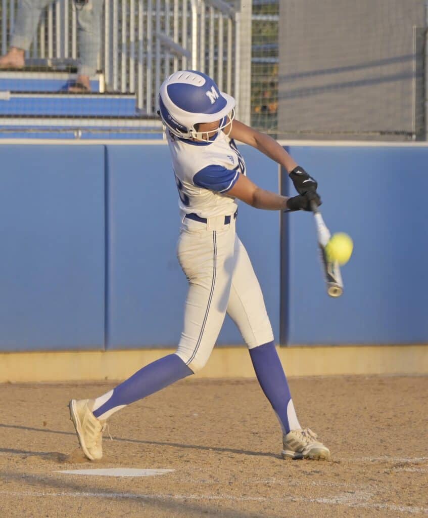 Photo - Madera freshman Savana Cortez connects on a second inning triple that gave the Coyotes a 6-2 lead. Madera held on for a 6-5 victory Tuesday over the Edison Tigers. 