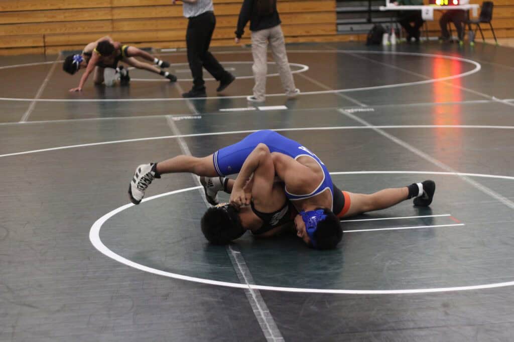 Photo - Madera’s Jose Diaz tries to get near fall points against his 138-pound opponent from Central during Saturday’s Mad Ranch Duals at Liberty High School. He helped Madera win the overall title.
