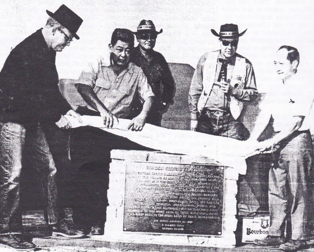 Photo - Frank Tuck, 2nd from the left, leads a delegation of history lovers in unveiling the plaque honoring the Borden Chinese Cemetery.