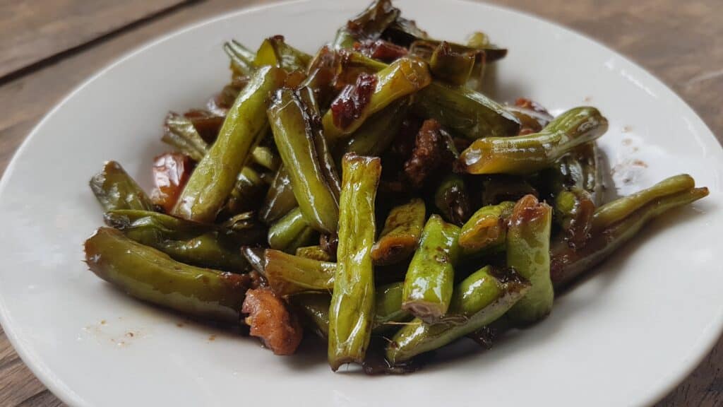 Photo - Stir fry some fresh green beans and roasted garlic in a bit of oil and soy sauce. Add some chopped pork, if desired, for a main dish.