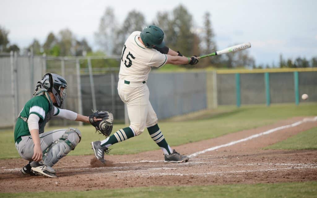 Photo - Liberty’s Colton Cardoza rips a double against Dinuba in a make-up game last week. He ripped another double in Thursday’s 8-1 victory over the Washington Union Panthers.