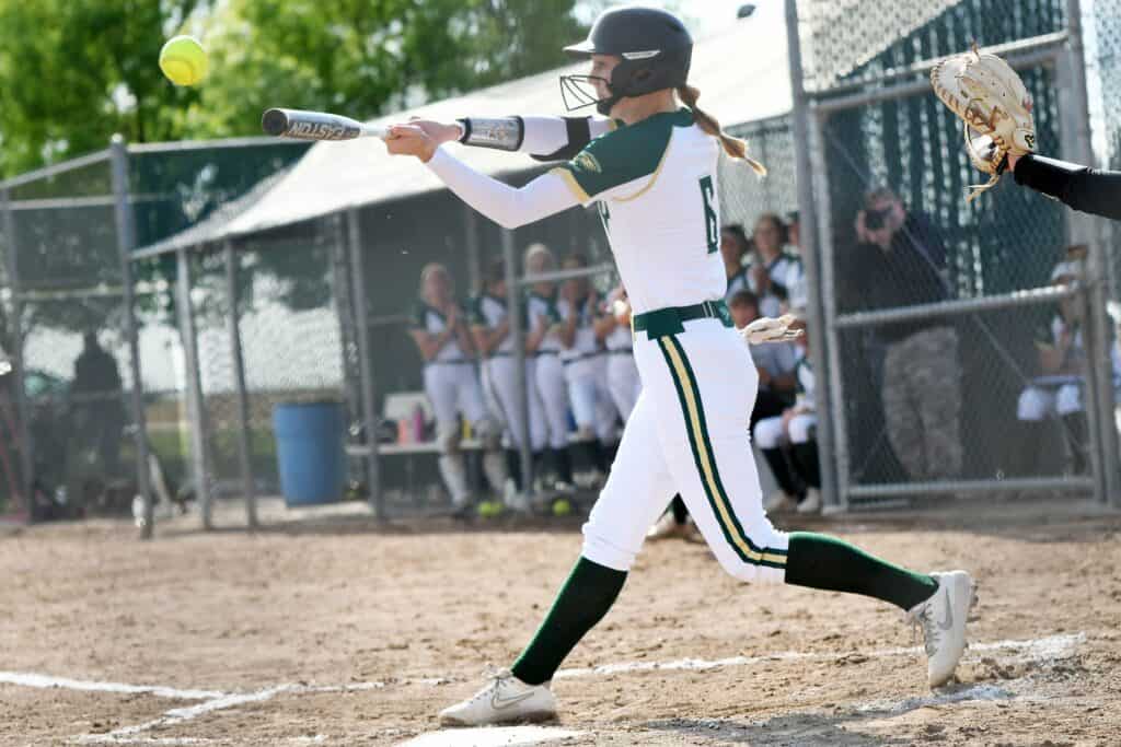 Photo - Liberty’s Maci Whaley hits a high pitch to deep left field for a three-run double to provide the only runs in a victory over Fowler on Tuesday.