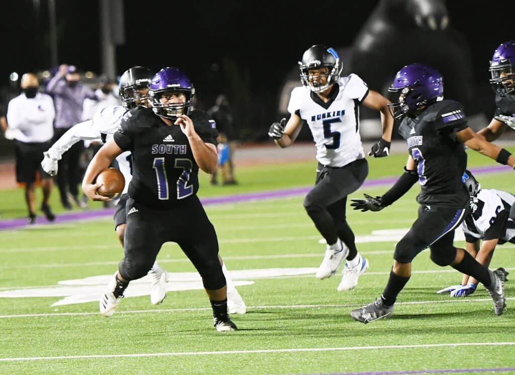 Photo - Madera South’s Christian Marroquin finds open space for a third quarter touchdown run in Friday’s victory over Hanford West.